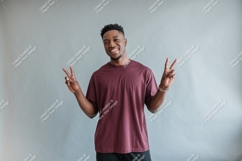 Man maroon shirt peace sign image Product Image 1