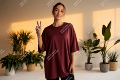 Woman wearing maroon t shirt peace sign image Product Image 1