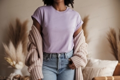 Woman wearing lavender t shirt and denim jeans image Product Image 1