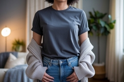 Woman wearing grey t shirt and blue jeans t-shirt Product Image 1