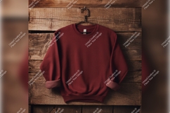 Maroon Sweatshirt On Wooden Background Tshirt Mockup Product Image 1