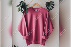 Pink Sweatshirt Hanging With Green Plants Tshirt Mockup Product Image 1