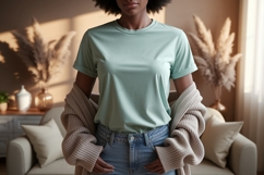 Woman wearing mint t shirt and beige cardigan image Product Image 1