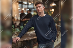 Man Wearing Navy Tshirt Mockup In Cafe Product Image 1