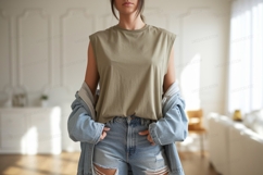 Woman wearing olive green tank top denim shorts and denim ja Product Image 1