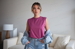 Woman wearing pink top and denim jacket Product Image 1