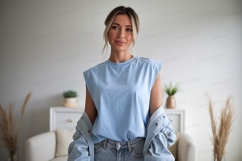 Woman wearing blue shirt and denim jacket Product Image 1