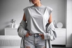 Woman wearing grey top denim jacket ripped jeans image Product Image 1