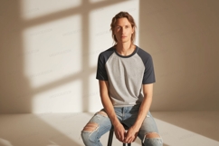 Man wearing raglan shirt and ripped jeans grey navy Product Image 1