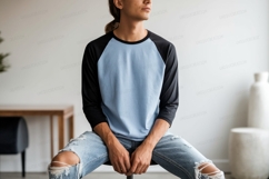 Man wearing baseball shirt and ripped jeans Product Image 1
