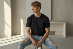 Man wearing black shirt ripped jeans image Product Image 1