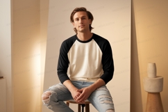 Man wearing baseball shirt and ripped jeans Product Image 1