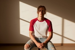 Young man wearing red and white baseball shirt image Product Image 1