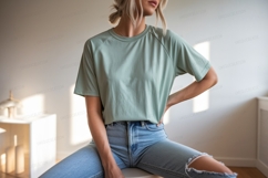 Woman wearing green t shirt and jeans image Product Image 1