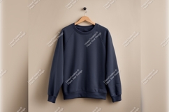 Navy Sweatshirt Hanging On Wall Tshirt Mockup Product Image 1