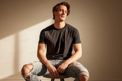 Man wearing dark t shirt ripped jeans image Product Image 1