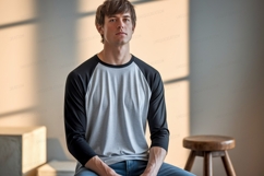 Young man wearing grey and black baseball shirt image Product Image 1