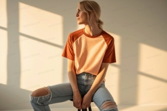 Woman wearing baseball tee and ripped jeans blonde Product Image 1