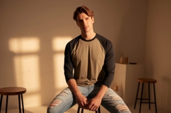 Young man wearing baseball shirt and ripped jeans image Product Image 1