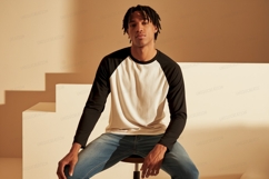 Young man wearing baseball shirt black Product Image 1