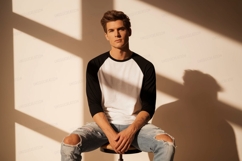Young man wearing baseball shirt ripped jeans image Product Image 1