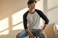 Man wearing baseball shirt and ripped jeans Product Image 1