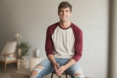 Young man wearing baseball shirt and ripped jeans casual Product Image 1