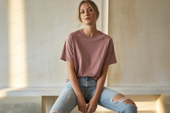 Woman wearing pink t shirt ripped jeans t-shirt Product Image 1