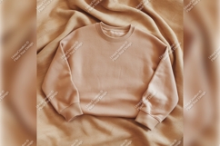 Beige Sweatshirt Tshirt Mockup On Textured Fabric Product Image 1