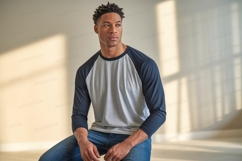 Man wearing grey and navy baseball shirt image Product Image 1