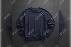 Navy Blue Sweatshirt On Dark Wood Background Product Image 1