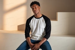 Man wearing baseball shirt and jeans Product Image 1