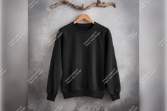 Black Tshirt Mockup Hanging Against Grey Wall Product Image 1