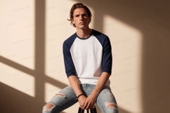Man wearing baseball shirt and ripped jeans navy white Product Image 1