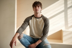 Man wearing raglan shirt ripped jeans image Product Image 1