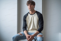 Man wearing baseball shirt and ripped jeans raglan Product Image 1