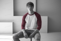 Young man wearing baseball shirt maroon Product Image 1