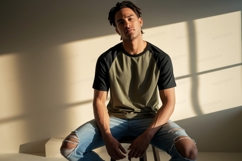 Man wearing olive black raglan shirt ripped jeans image Product Image 1