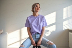 Woman wearing lavender t shirt ripped jeans image Product Image 1