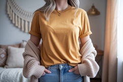 Woman wearing mustard t shirt and jeans image Product Image 1