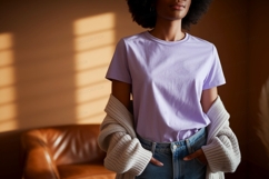 Woman wearing lavender t shirt and denim image Product Image 1