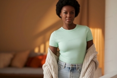 Woman wearing mint t shirt and cardigan Product Image 1