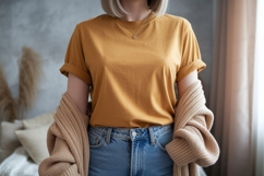Woman wearing mustard t shirt and blue jeans image Product Image 1