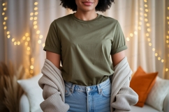Woman wearing olive green t shirt and jeans image Product Image 1