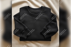 Folded Black Sweatshirt Tshirt Mockup On Fabric Product Image 1