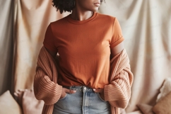 Woman wearing orange shirt and cardigan denim Product Image 1