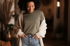 Woman wearing green shirt and blue jeans image Product Image 1