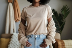 Woman wearing beige t shirt and jeans image Product Image 1