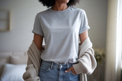 Woman wearing grey t shirt and jeans Product Image 1