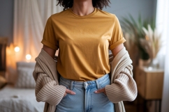 Woman wearing mustard yellow t shirt and blue Product Image 1